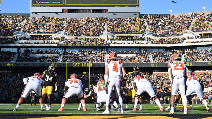 Nov 18, 2023; Iowa City, Iowa, USA; Illinois Fighting Illini quarterback John Paddock (4) and running back Reggie Love III (23) lead the offense against the Iowa Hawkeyes during the first quarter at Kinnick Stadium. Mandatory Credit: Jeffrey Becker-USA TODAY Sports