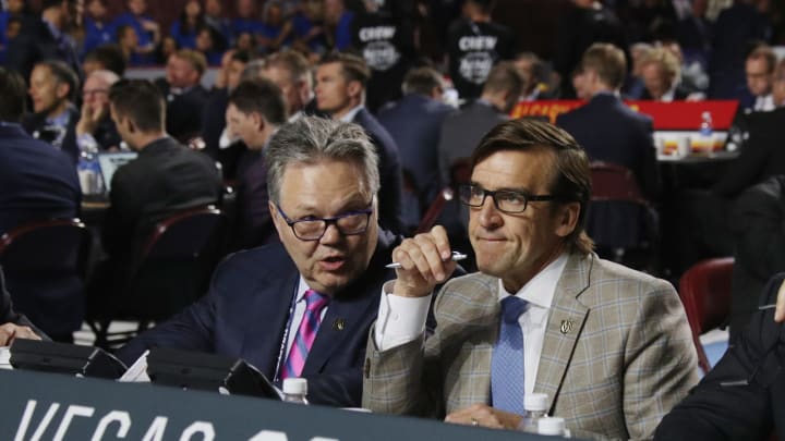 VANCOUVER, BRITISH COLUMBIA – JUNE 22: (L-R) Kelly McCrimmon and George McPhee (Photo by Bruce Bennett/Getty Images)