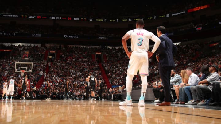 MIAMI, FL - FEBRUARY 9: Dwyane Wade and Coach Erik Spoelstra of the Miami Heat look on during the game against the Milwaukee Bucks on February 9, 2018 at American Airlines Arena in Miami, Florida. NOTE TO USER: User expressly acknowledges and agrees that, by downloading and or using this photograph, user is consenting to the terms and conditions of the Getty Images License Agreement. Mandatory Copyright Notice: Copyright 2018 NBAE (Photo by Issac Baldizon/NBAE via Getty Images)