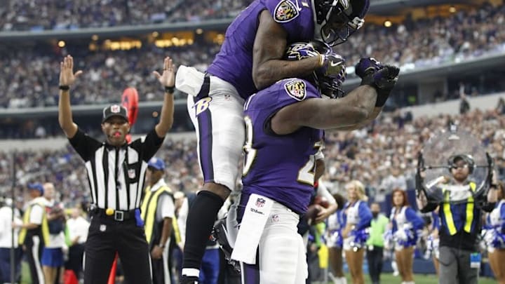 Nov 20, 2016; Arlington, TX, USA; Baltimore Ravens running back Terrance West (28) celebrates scoring a touchdown with wide receiver Mike Wallace (17) in the first quarter against the Dallas Cowboys at AT&T Stadium. Mandatory Credit: Tim Heitman-USA TODAY Sports