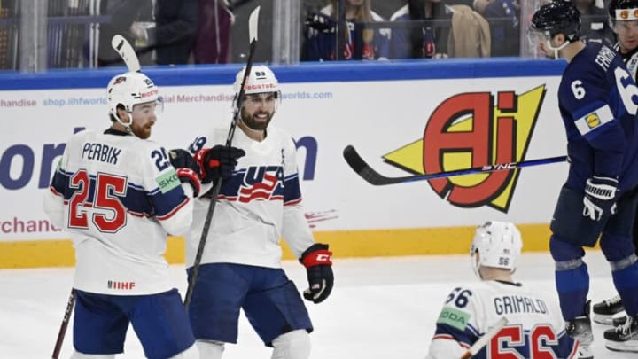 United States' forward Alex Tuch (C) celebrates his 1-3 goal with United States' defender Nick Perbix (L) and United States' forward Rocco Grimaldi during the IIHF Ice Hockey Men's World Championships Preliminary Round - Group A match between Finland and the United States in Tampere, Finland, on May 12, 2023. (Photo by Antti Aimo-Koivisto / Lehtikuva / AFP) / Finland OUT (Photo by ANTTI AIMO-KOIVISTO/Lehtikuva/AFP via Getty Images)