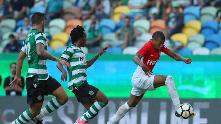 LISBON, PORTUGAL - JULY 22: Monaco forward Kylian Mbappe from France (R) tries to escape Sporting CP forward Gelson Martins from Portugal (C) during the Friendly match between Sporting CP and AS Monaco at Estadio Jose Alvalade on July 22, 2017 in Lisbon, Portugal. (Photo by Carlos Rodrigues/Getty Images)