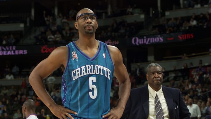 11 Dec 2001: Elden Campbell #5 of the Charlotte Hornets and head coach Paul Silas look temporarily disgruntled after Campbell fouled out in the final minute against the Denver Nuggets at the Pepsi Center in Denver, Colorado. The Hornets held on to win 99-96. DIGITAL IMAGE NOTE TO USER: User expressly acknowledges and agrees that, by downloading and/or using this Photograph, User is consenting to the terms and conditions of the Getty Images License Agreement. Mandatory Credit: Brian Bahr/ALLSPORT