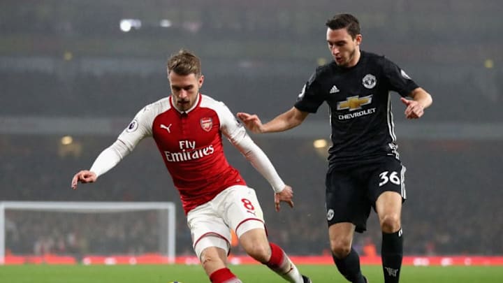 LONDON, ENGLAND - DECEMBER 02: Aaron Ramsey of Arsenal is challenged by Matteo Darmian of Manchester United during the Premier League match between Arsenal and Manchester United at Emirates Stadium on December 2, 2017 in London, England. (Photo by Julian Finney/Getty Images)