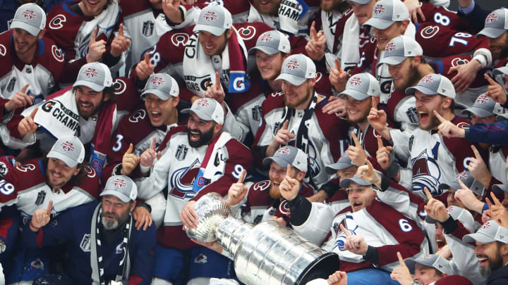 Jun 26, 2022; Tampa, Florida, USA; The Colorado Avalanche pose for a team photo with the Stanley Cup trophy after defeating the Tampa Bay Lightning to win the Stanley Cup in game six of the 2022 Stanley Cup Final at Amalie Arena. Mandatory Credit: Mark J. Rebilas-USA TODAY Sports