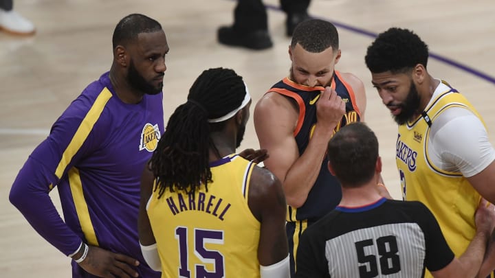 LOS ANGELES, CALIFORNIA – MAY 19: Anthony Davis #3, Montrezl Harrell #15, and LeBron James #23 of the Los Angeles Lakers and Stephen Curry #30 of the Golden State Warriors. (Photo by Kevork Djansezian/Getty Images)