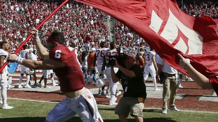 Oct 8, 2016; Dallas, TX, USA; Oklahoma Sooners quarterback Baker Mayfield (6) waves a flag after the game against the Texas Longhorns at Cotton Bowl. Oklahoma won 45-40. Mandatory Credit: Tim Heitman-USA TODAY Sports