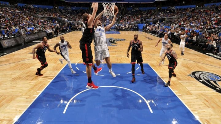 ORLANDO, FL - FEBRUARY 28: Evan Fournier #10 of the Orlando Magic shoots the ball during the game against the Toronto Raptors on February 28, 2018 at Amway Center in Orlando, Florida. NOTE TO USER: User expressly acknowledges and agrees that, by downloading and or using this photograph, User is consenting to the terms and conditions of the Getty Images License Agreement. Mandatory Copyright Notice: Copyright 2018 NBAE (Photo by Fernando Medina/NBAE via Getty Images)