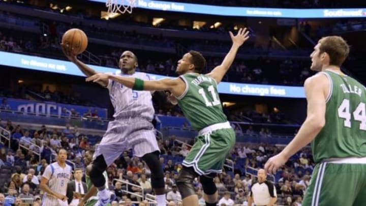 Mar 8, 2015; Orlando, FL, USA; Orlando Magic guard Victor Oladipo (5) shoots as Boston Celtics guard Evan Turner (11) defends during the first quarter at Amway Center. Mandatory Credit: Tommy Gilligan-USA TODAY Sports