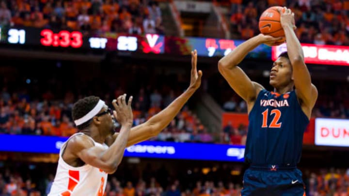 SYRACUSE, NY – MARCH 04: De’Andre Hunter #12 of the Virginia Cavaliers shoots the ball during the first half as he is fouled by Paschal Chukwu #13 of the Syracuse Orange at the Carrier Dome on March 4, 2019, in Syracuse, New York. (Photo by Brett Carlsen/Getty Images)