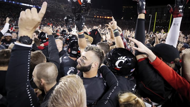 CINCINNATI, OH – OCTOBER 04: Cincinnati Bearcats players and fans celebrate after the game against the Central Florida Knights at Nippert Stadium on October 4, 2019 in Cincinnati, Ohio. Cincinnati defeated Central Florida 27-24. (Photo by Joe Robbins/Getty Images)