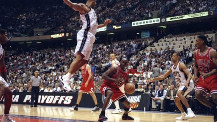 29 Apr 1998: Michael Jordan #23 of the Chicago Bulls in action against Jason Williams #55 of the New Jersey Nets during the NBA Playoffs round 3 game at the Continental Airlines Arena in East Rutherford, New Jersey. The Bulls defeated the Nets 116-101.
