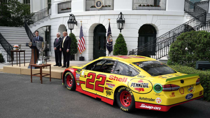 WASHINGTON, DC - APRIL 30: 2018 Monster Energy NASCAR Cup Series Champion Joey Logano (L) delivers brief remarks during an event with U.S. President Donald Trump (R) and Team Penske owner Roger Penski on the South Lawn of the White House April 30, 2019 in Washington, DC. Nicknamed 'Sliced Bread," Logano races for Team Penske. HE visited the White House with wife Brittany Baca and son Hudson Joseph Logano. (Photo by Chip Somodevilla/Getty Images)