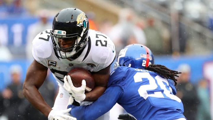 EAST RUTHERFORD, NJ - SEPTEMBER 09: Leonard Fournette #27 of the Jacksonville Jaguars runs with the ball against Janoris Jenkins #20 of the New York Giants in the first quarter at MetLife Stadium on September 9, 2018 in East Rutherford, New Jersey. (Photo by Mike Lawrie/Getty Images)