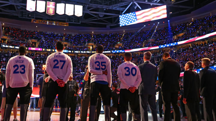 CLEVELAND, OH – JUNE 09: The Golden State Warriors stand for the National Anthem prior to Game 4 of the 2017 NBA Finals against the Cleveland Cavaliers at Quicken Loans Arena on June 9, 2017 in Cleveland, Ohio. NOTE TO USER: User expressly acknowledges and agrees that, by downloading and or using this photograph, User is consenting to the terms and conditions of the Getty Images License Agreement. (Photo by Ronald Martinez/Getty Images)