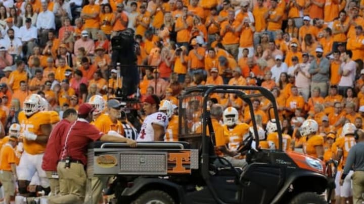 Sep 12, 2015; Knoxville, TN, USA; Oklahoma Sooners running back Rodney Anderson (24) is attended by team personnel after suffering an injury during the second quarter at Neyland Stadium. Mandatory Credit: Randy Sartin-USA TODAY Sports