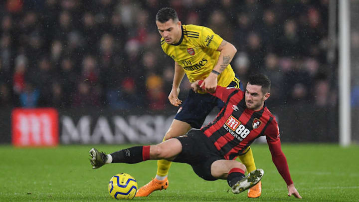 BOURNEMOUTH, ENGLAND - DECEMBER 26: Lewis Cook of AFC Bournemouth battles for possession with Granit Xhaka of Arsenal during the Premier League match between AFC Bournemouth and Arsenal FC at Vitality Stadium on December 26, 2019 in Bournemouth, United Kingdom. (Photo by Justin Setterfield/Getty Images)