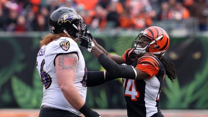 Jan 3, 2016; Cincinnati, OH, USA; Baltimore Ravens center Ryan Jensen (66) scrums with Cincinnati Bengals cornerback Adam Jones (24) in the first half at Paul Brown Stadium. The bengals won 24-16. Mandatory Credit: Aaron Doster-USA TODAY Sports