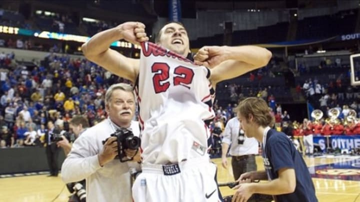Mar 15, 2013; Nashville, TN, USA; Mississippi Rebels guard Marshall Henderson (22) celebrates after defeating the Missouri Tigers during the quarterfinals of the SEC tournament at Bridgestone Arena. Mississippi won 62-64. Mandatory Credit: Joshua Lindsey-USA TODAY Sports