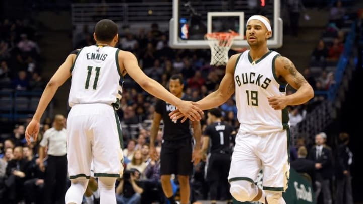 Mar 4, 2016; Milwaukee, WI, USA; Milwaukee Bucks guard Jerryd Bayless (19) reacts with guard Tyler Ennis (11) after hitting a 3-point basket in the second quarter during the game against the Minnesota Timberwolves at BMO Harris Bradley Center. Mandatory Credit: Benny Sieu-USA TODAY Sports