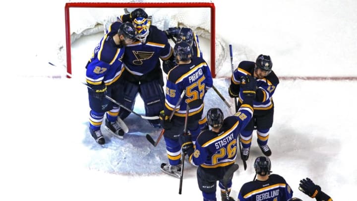 May 15, 2016; St. Louis, MO, USA; St. Louis Blues goalie Brian Elliott (1) is congratulated by teammates after defeating the San Jose Sharks in game one of the Western Conference Final of the 2016 Stanley Cup Playoffs at Scottrade Center. The Blues won the game 2-1. Mandatory Credit: Billy Hurst-USA TODAY Sports