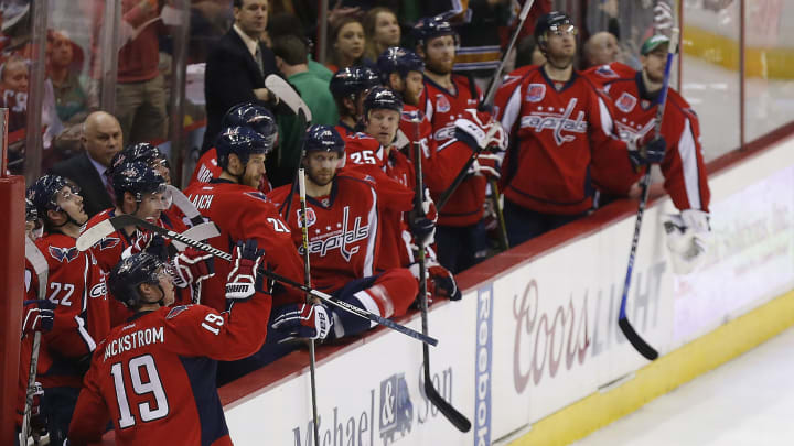 Mar 15, 2015; Washington, DC, USA; Washington Capitals center Nicklas Backstrom (19) waves to the crowd after assisting on a goal by Washington Capitals defenseman John Carlson (not pictured) against the Boston Bruins in the first period at Verizon Center. Backstrom became the franchise’s all-time assist leader on the play. Mandatory Credit: Geoff Burke-USA TODAY Sports