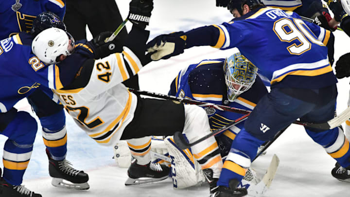 ST. LOUIS, MO - JUN 03: St. Louis Blues center Ryan O'Reilly (90) knocks down Boston Bruins rightwing David Backes (42) late in the game during Game 4 of the Stanley Cup Final between the Boston Bruins and the St. Louis Blues, on June 01, 2019, at Enterprise Center, St. Louis, Mo. (Photo by Keith Gillett/Icon Sportswire via Getty Images)