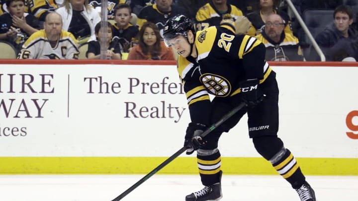 Apr 21, 2022; Pittsburgh, Pennsylvania, USA; Boston Bruins center Curtis Lazar (20) skates with the puck against the Pittsburgh Penguins during the third period at PPG Paints Arena. Mandatory Credit: Charles LeClaire-USA TODAY Sports