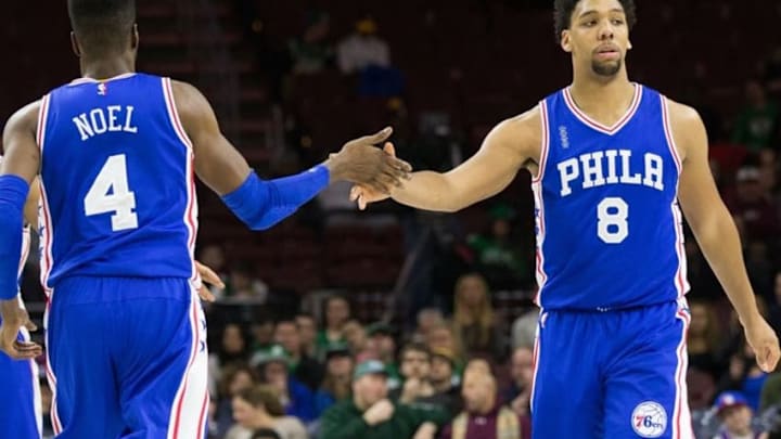 Jan 24, 2016; Philadelphia, PA, USA; Philadelphia 76ers forward Nerlens Noel (4) and center Jahlil Okafor (8) react after a score against the Boston Celtics during the second quarter at Wells Fargo Center. Mandatory Credit: Bill Streicher-USA TODAY Sports