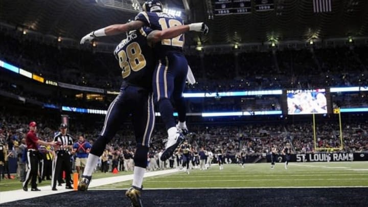 Dec 15, 2013; St. Louis, MO, USA; St. Louis Rams tight end Lance Kendricks (88) celebrates with wide receiver Stedman Bailey (12) after catching a four yard touchdown pass against the New Orleans Saints during the first half at the Edward Jones Dome. Mandatory Credit: Jeff Curry-USA TODAY Sports