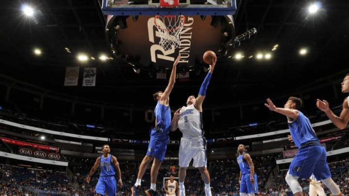 ORLANDO, FL - OCTOBER 5: Nikola Vucevic #9 of the Orlando Magic shoots the ball against the Dallas Mavericks during a preseason game on October 5, 2017 at Amway Center in Orlando, Florida. NOTE TO USER: User expressly acknowledges and agrees that, by downloading and or using this photograph, User is consenting to the terms and conditions of the Getty Images License Agreement. Mandatory Copyright Notice: Copyright 2017 NBAE (Photo by Fernando Medina/NBAE via Getty Images)