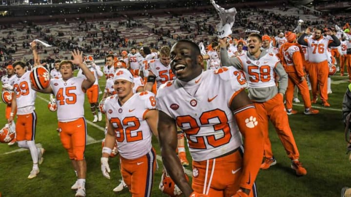 Clemson cornerback Andrew Booth Jr. (23) and teammates celebrate their win after the game at Williams Brice Stadium in Columbia, South Carolina Saturday, November 27, 2021. Clemson won 30-0.Clemson U Of Sc Football In Columbia