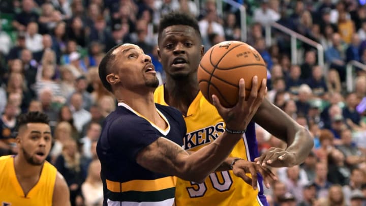 SALT LAKE CITY, UT - OCTOBER 28: George Hill #3 of the Utah Jazz tries for a basket past the defense of Julius Randle #30 of the Los Angeles Lakers in the second half of the 96-89 win by the Jazz at Vivint Smart Home Arena on October 28, 2016 in Salt Lake City, Utah. NOTE TO USER: User expressly acknowledges and agrees that, by downloading and or using this photograph, User is consenting to the terms and conditions of the Getty Images License Agreement. (Photo by Gene Sweeney Jr/Getty Images)