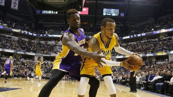 Feb 8, 2016; Indianapolis, IN, USA; Los Angeles Lakers forward Julius Randle (30) defends Indiana Pacers guard Monta Ellis (11) at Bankers Life Fieldhouse. The Indiana Pacers defeat the Los Angeles Lakers 89-87. Mandatory Credit: Brian Spurlock-USA TODAY Sports