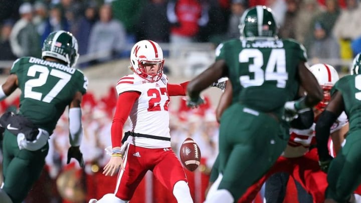 Oct 4, 2014; East Lansing, MI, USA; Nebraska Cornhuskers punter Sam Foltz (27) attempts a punt during the 1st quarter of a game at Spartan Stadium. Mandatory Credit: Mike Carter-USA TODAY Sports