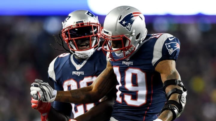 Dec 12, 2016; Foxborough, MA, USA; New England Patriots wide receiver Malcolm Mitchell (19) and running back LeGarrette Blount (29) celebrate a touchdown against the Baltimore Ravens during the first half at Gillette Stadium. Mandatory Credit: Bob DeChiara-USA TODAY Sports