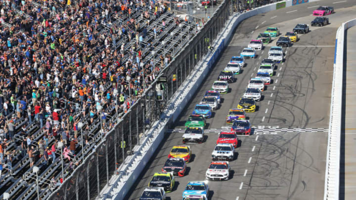 MARTINSVILLE, VIRGINIA - OCTOBER 27: Denny Hamlin, driver of the #11 FedEx Freight Toyota, takes the checkered flag to start the Monster Energy NASCAR Cup Series First Data 500 at Martinsville Speedway on October 27, 2019 in Martinsville, Virginia. (Photo by Brian Lawdermilk/Getty Images)
