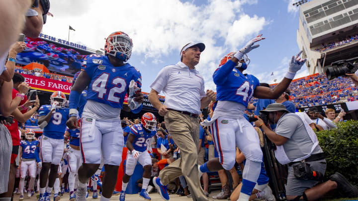GAINESVILLE, FL- SEPTEMBER 21: Head coach Dan Mullen of the Florida Gators takes the field with his players prior to the start of the game against the Tennessee Volunteers at Ben Hill Griffin Stadium on September 21, 2019 in Gainesville, Florida. (Photo by Carmen Mandato/Getty Images)