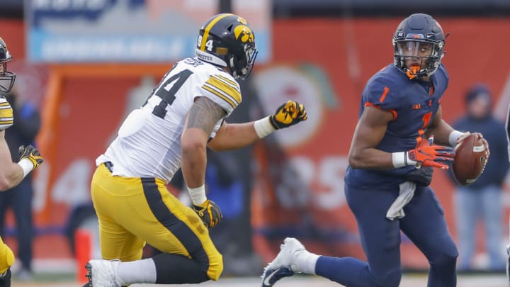 CHAMPAIGN, IL – NOVEMBER 17: AJ Bush #1 of the Illinois Fighting Illini scrambles out of the pocket as A.J. Epenesa #94 of the Iowa Hawkeyes pursues at Memorial Stadium on November 17, 2018 in Champaign, Illinois. (Photo by Michael Hickey/Getty Images)