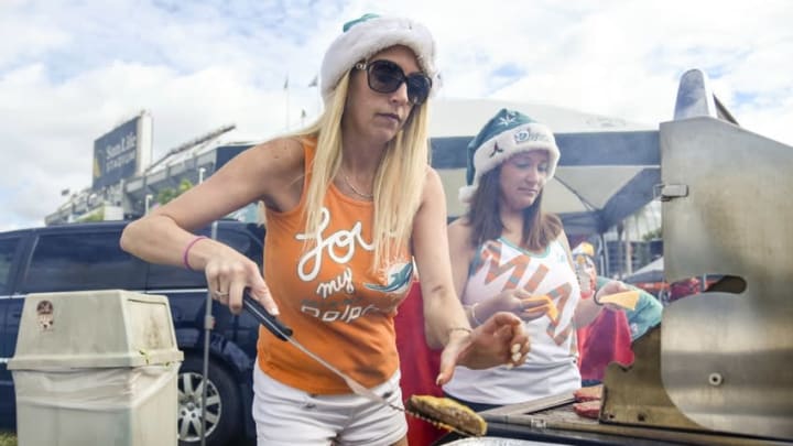 Dec 21, 2014; Miami Gardens, FL, USA; Miami Dolphins fans Dawn Ieronimo and Amy Yents (right) tailgate prior to the game the Minnesota Vikings at Sun Life Stadium. Mandatory Credit: Brad Barr-USA TODAY Sports