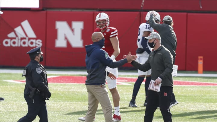 Nov 14, 2020; Lincoln, Nebraska, USA; Nebraska Cornhuskers head coach Scott Frost and Penn State Nittany Lions head coach James Franklin congratulate each other after the game at Memorial Stadium. Mandatory Credit: Bruce Thorson-USA TODAY Sports