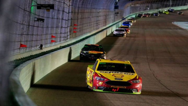 HOMESTEAD, FL - NOVEMBER 18: Joey Logano, driver of the #22 Shell Pennzoil Ford, races Martin Truex Jr., driver of the #78 Bass Pro Shops/5-hour ENERGY Toyota, during the Monster Energy NASCAR Cup Series Ford EcoBoost 400 at Homestead-Miami Speedway on November 18, 2018 in Homestead, Florida. (Photo by Chris Trotman/Getty Images)