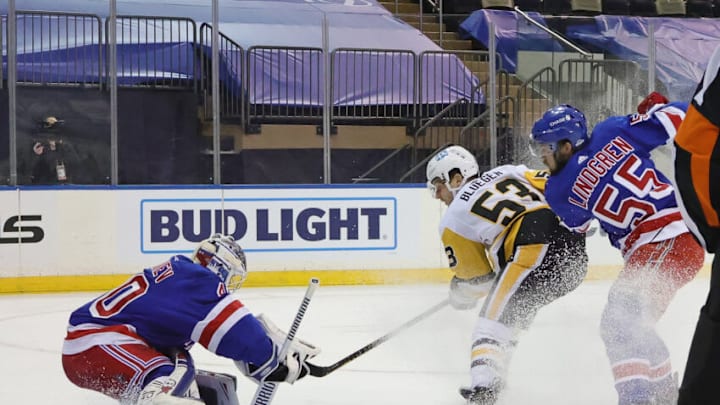NEW YORK, NEW YORK - JANUARY 30: Alexandar Georgiev #40 and Ryan Lindgren #55 of the New York Rangers defend against Teddy Blueger #53 of the Pittsburgh Penguins during the first period at Madison Square Garden on January 30, 2021 in New York City. (Photo by Bruce Bennett/Getty Images)