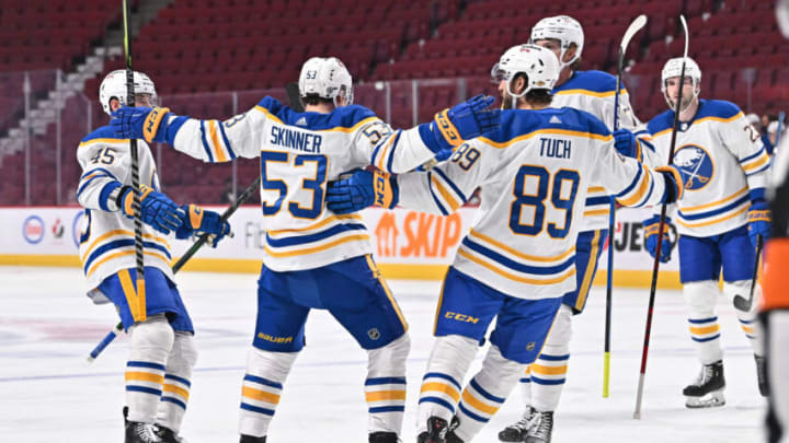 MONTREAL, QC - FEBRUARY 13: Jeff Skinner #53 of the Buffalo Sabres celebrates his goal with teammates Casey Fitzgerald #45 (L) and Alex Tuch #89 (R) during the first period against the Montreal Canadiens at Centre Bell on February 13, 2022 in Montreal, Canada. (Photo by Minas Panagiotakis/Getty Images)