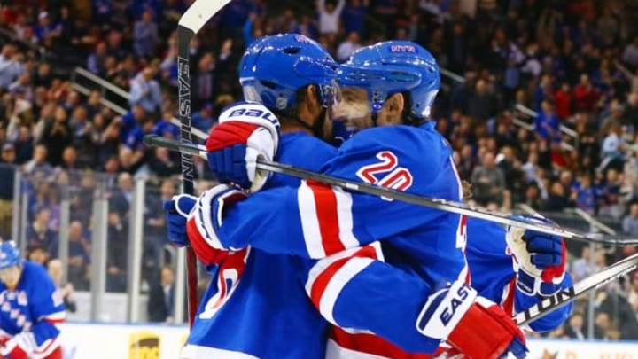 Feb 8, 2016; New York, NY, USA; New York Rangers left wing Chris Kreider (20) congratulates defenseman Kevin Klein (8) after a goal by Klein against the New Jersey Devils during the second period at Madison Square Garden. Mandatory Credit: Andy Marlin-USA TODAY Sports
