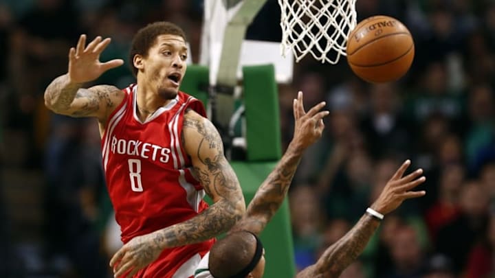 Mar 11, 2016; Boston, MA, USA; Boston Celtics guard Isaiah Thomas (4) shoots the ball against Houston Rockets forward Michael Beasley (8) during the first half at TD Garden. Mandatory Credit: Mark L. Baer-USA TODAY Sports