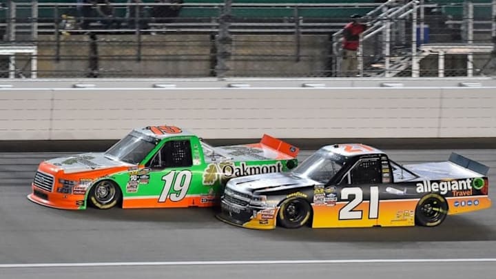 May 6, 2016; Kansas City, KS, USA; NASCAR Camping World Truck Series drivers Johnny Sauter (21) and Daniel Hemric (19) race during the Toyota Tundra 250 at Kansas Speedway. Mandatory Credit: Jasen Vinlove-USA TODAY Sports May 6, 2016; Kansas City, KS, USA; NASCAR Camping World Truck Series drivers Johnny Sauter (21) and Daniel Hemric (19) race during the Toyota Tundra 250 at Kansas Speedway. Mandatory Credit: Jasen Vinlove-USA TODAY Sports