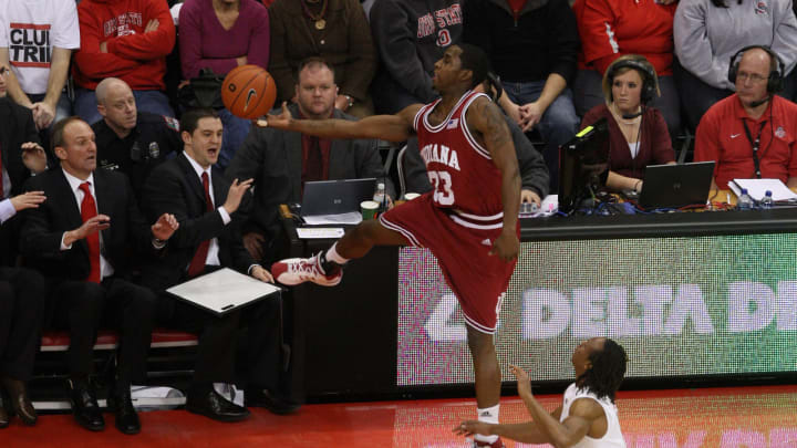 Jan 13, 2009; Columbus, OH, USA; Indiana Hoosiers guard Devan Dumes (33) jumps out of bounds for a loose ball against Ohio State Buckeyes guard P.J. Hill (4) in front of the Buckeyes bench at Value City Arena. The Buckeyes beat the Hoosiers 77-53. Mandatory Credit: Matthew Emmons-USA TODAY Sports