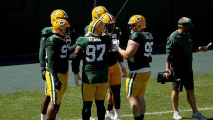 GREEN BAY, WISCONSIN – AUGUST 20: Members of the defensive line huddle during Green Bay Packers Training Camp at Lambeau Field on August 20, 2020 in Green Bay, Wisconsin. (Photo by Dylan Buell/Getty Images)