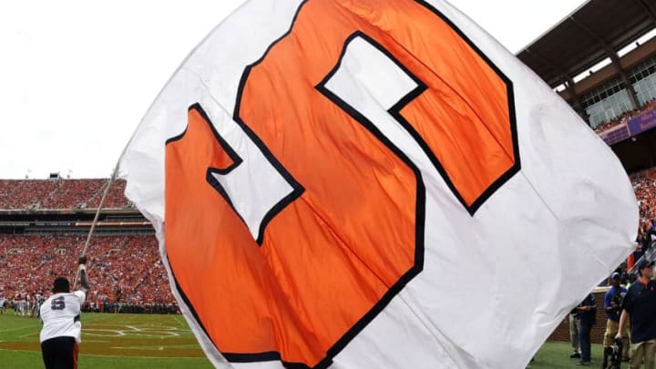 CLEMSON, SC - SEPTEMBER 29: A Syracuse Orange cheerleader waves a giant Orange flag during their football game against the Clemson Tigers at Clemson Memorial Stadium on September 29, 2018 in Clemson, South Carolina. (Photo by Mike Comer/Getty Images)
